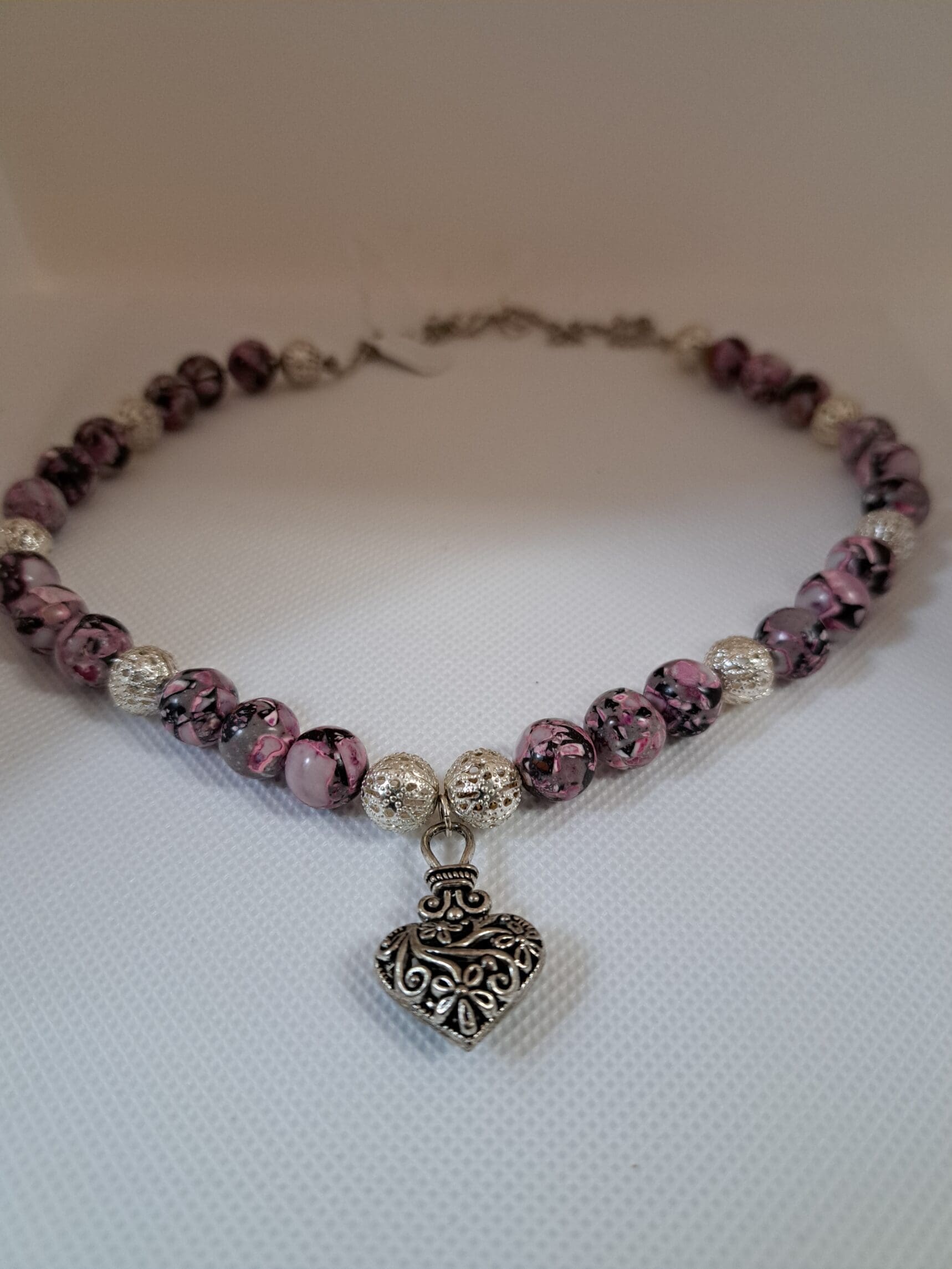 Stunning mottled pink and silver necklace with dangling heart Mottled pink and silver necklace
