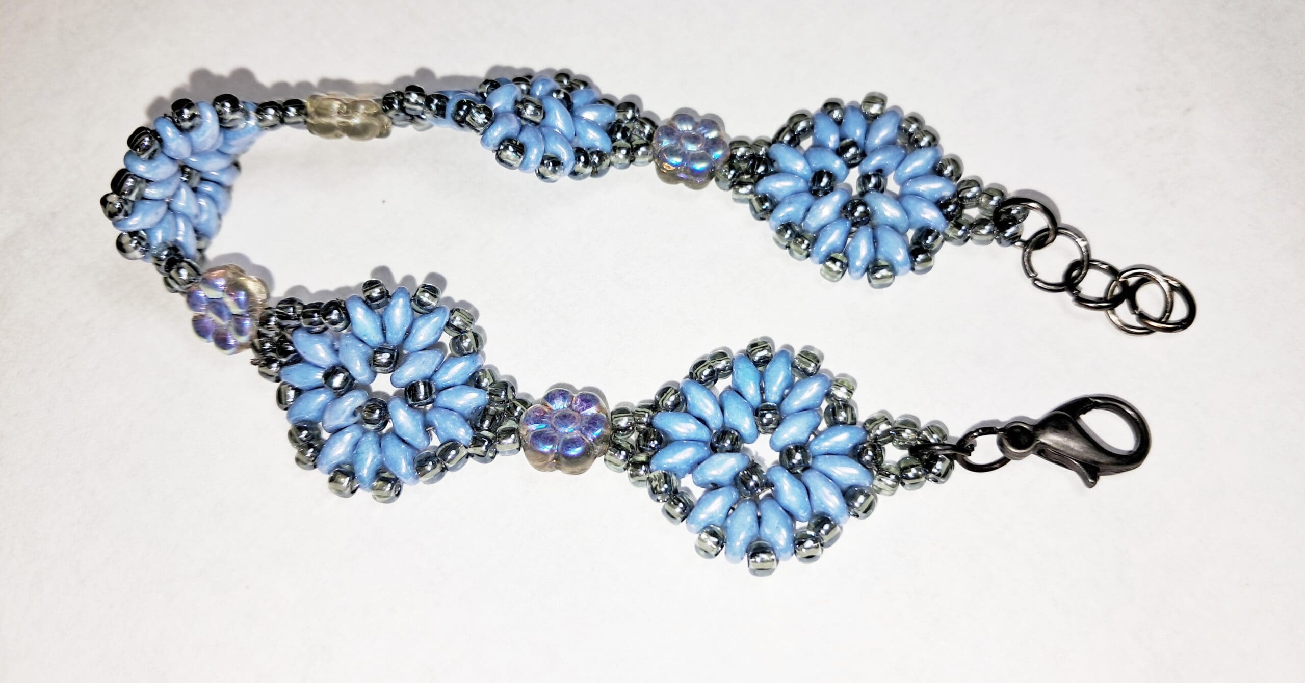 Blue petal beaded bracelet with iridescent flower accents Blue petal beaded bracelet