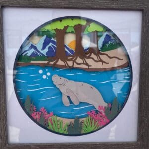 Swimming manatee shadow box