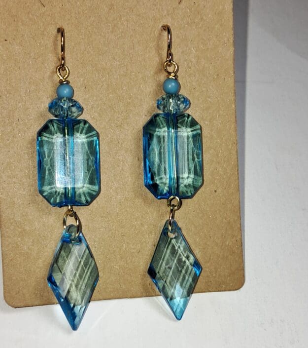 Sleek aqua blue acrylic geometric dangle earrings with gold plated ear wires Sleek aqua blue acrylic geometric dangle