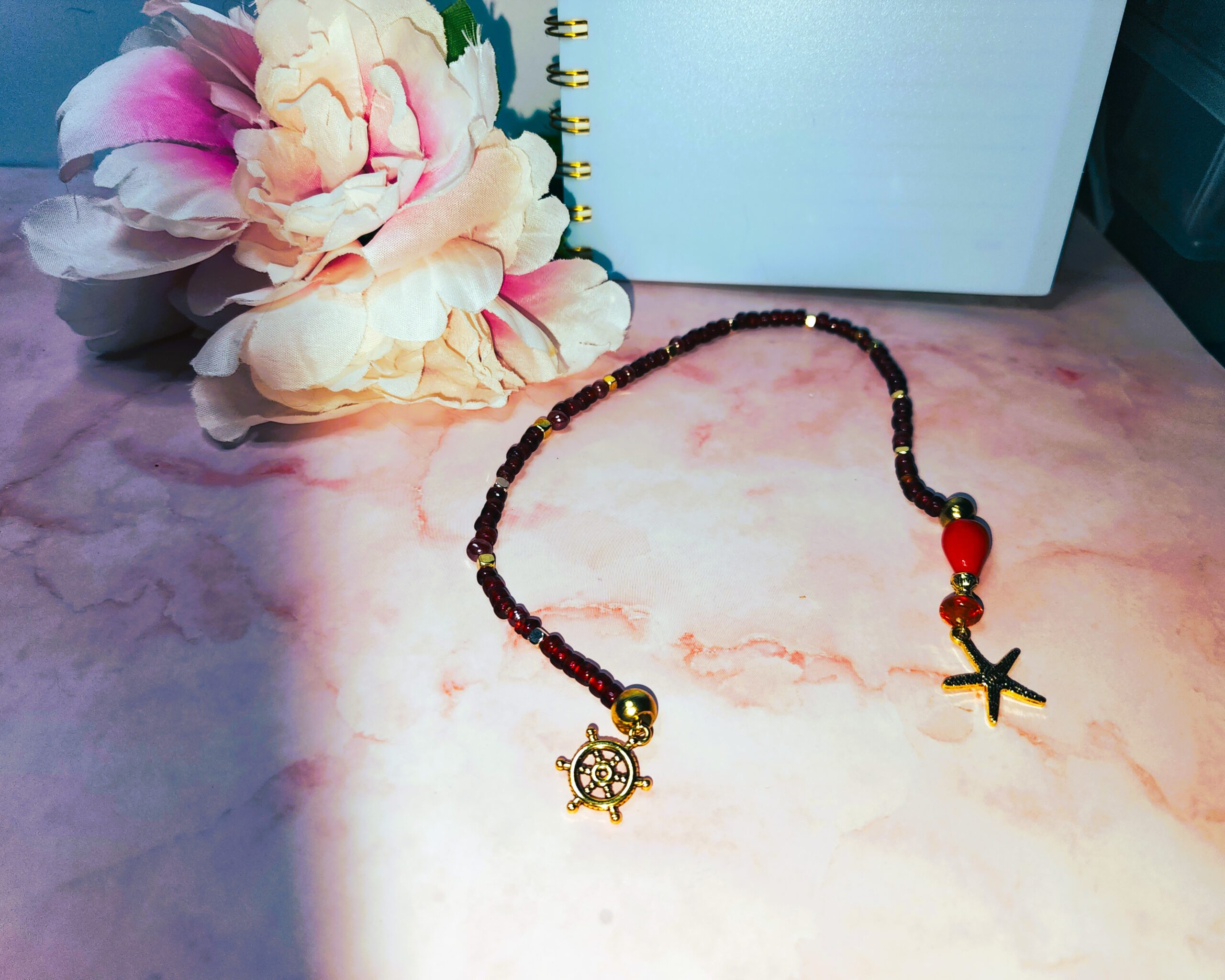 Red glass beaded bookmark with ocean themed gold tone charms Red glass beaded bookmark with ocean themed gold tone charms