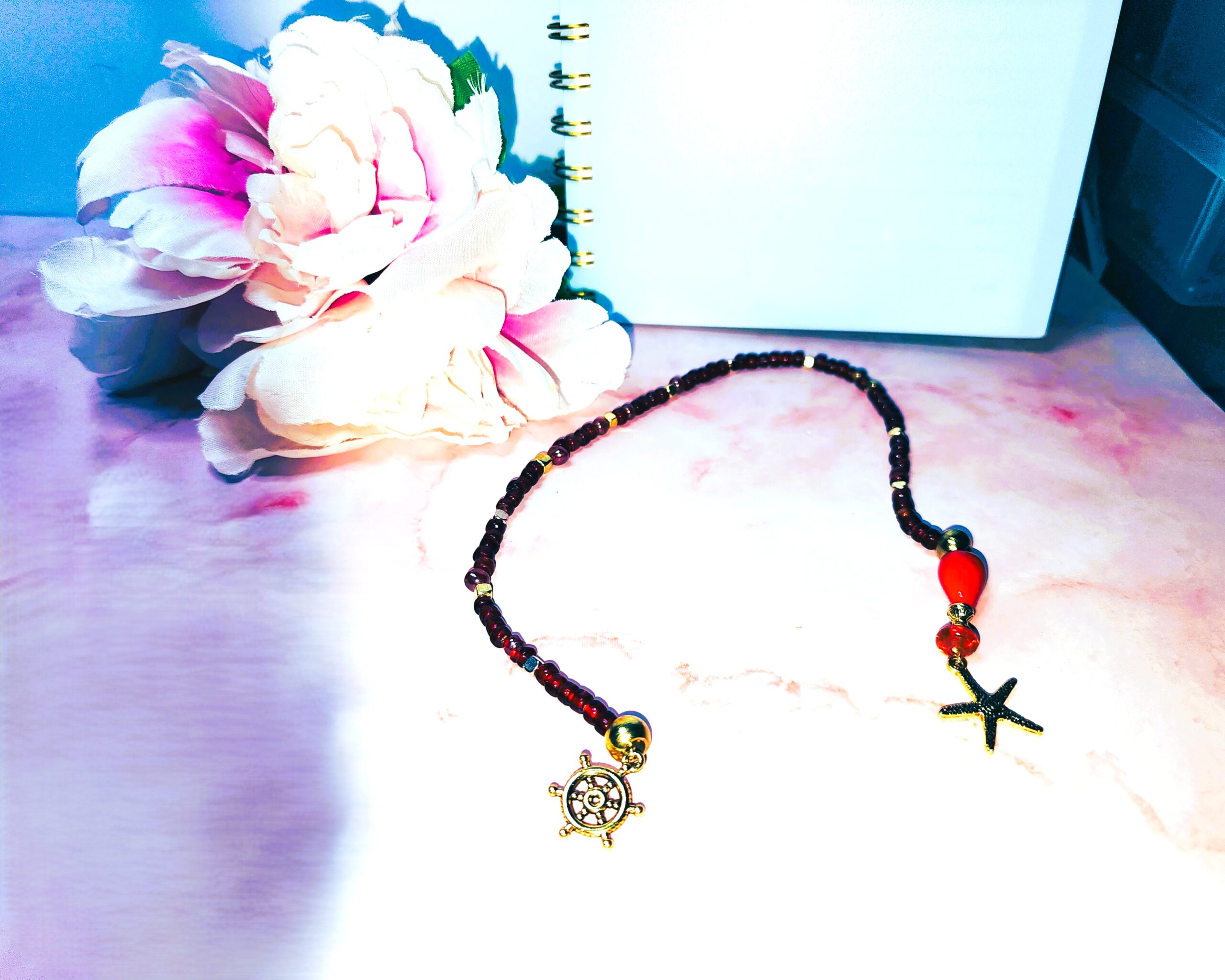 Red glass beaded bookmark with ocean themed gold tone charms Red glass beaded bookmark with ocean themed gold tone charms
