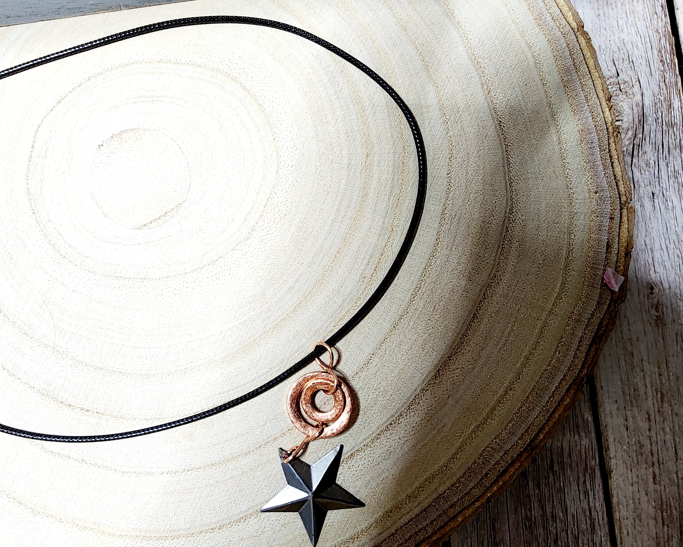 Handcrafted hammered copper washer necklace with silver star or copper bead on black cord Handcrafted hammered copper washer necklace with silver star or copper bead on black cord