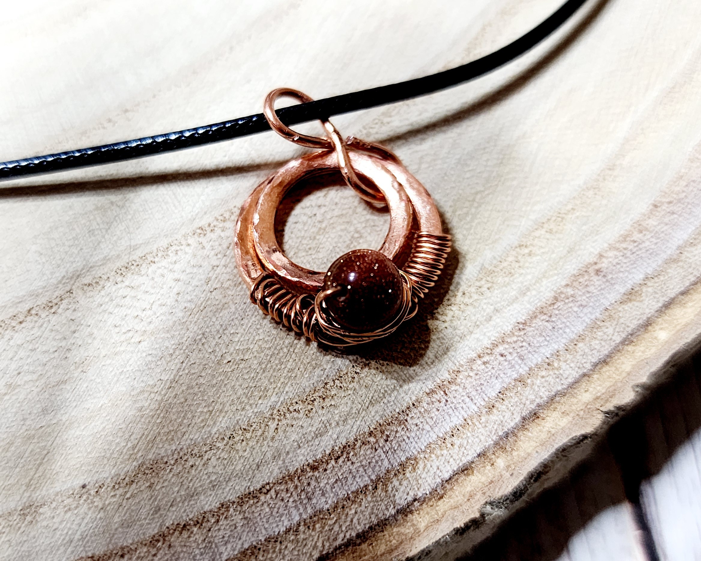 Handcrafted hammered copper washer necklace with silver star or copper bead on black cord Handcrafted hammered copper washer necklace with silver star or copper bead on black cord