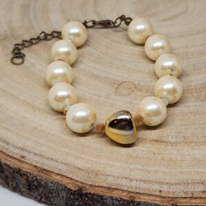 Faux Pearl Cream Colored Beads And Gold Colored Glass Accent Bead
