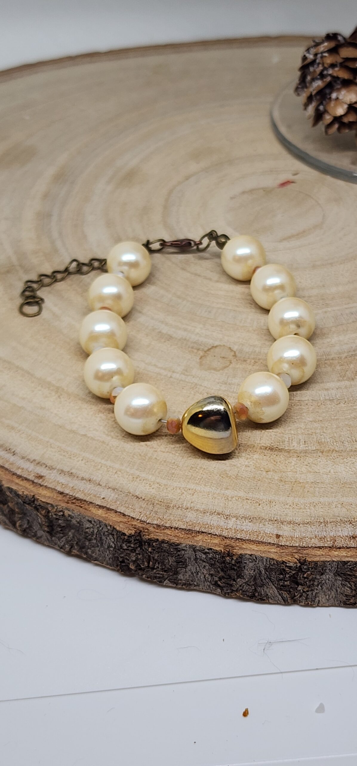 Faux pearl cream colored beads and gold colored glass accent bead Faux pearl cream colored beads and gold colored glass accent bead
