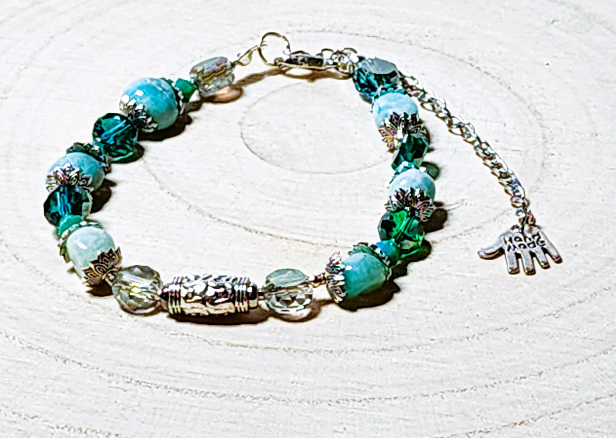 Evergreen glow holiday bracelet โ handcrafted beaded charm bracelet in green and gold Evergreen glow holiday bracelet โ handcrafted beaded charm bracelet in green and gold
